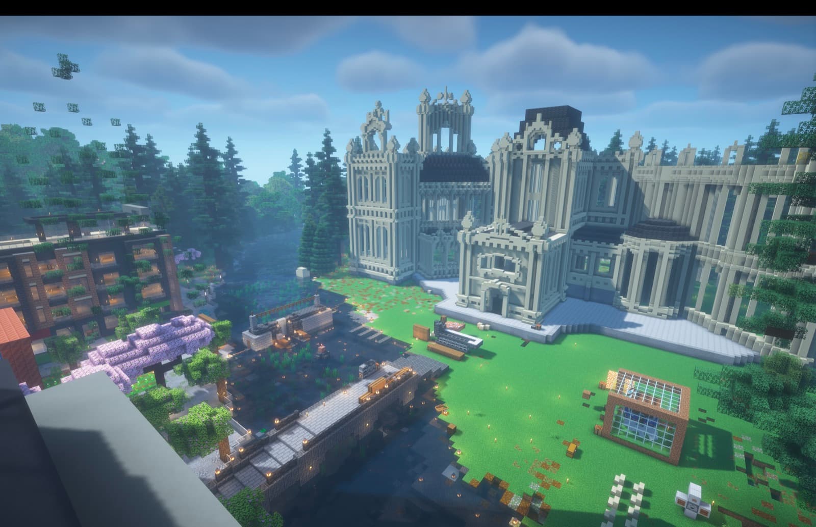 The civic hall on the far bank of the river.